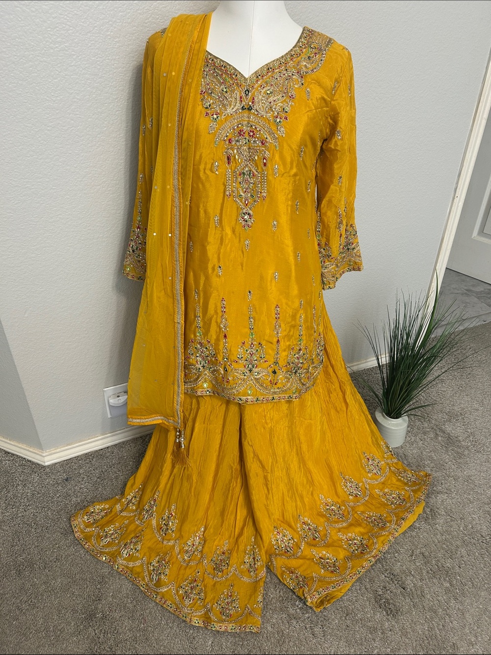 Yellow Sharara pants  short Kurta multi color work net duppatta. M